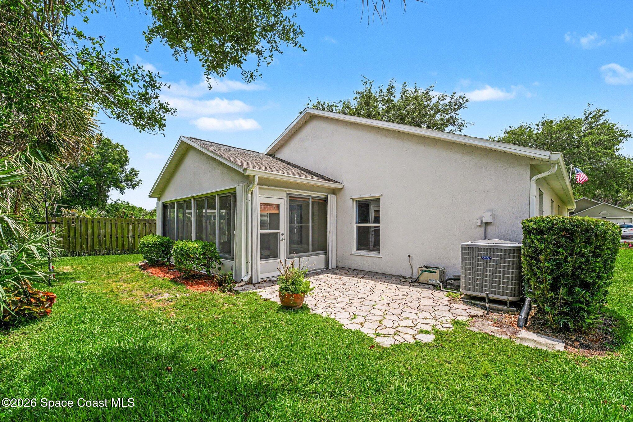 2194 Spring Creek Circle Palm Bay, FL 32905 - Photo 24 of 40 Back of Home.Paver Patio Area