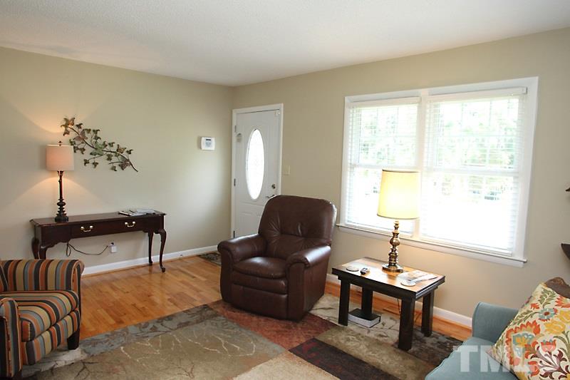 1019 Legend Road Raleigh, NC 27603 - Photo 3 of 12 a living room with furniture lamp and window