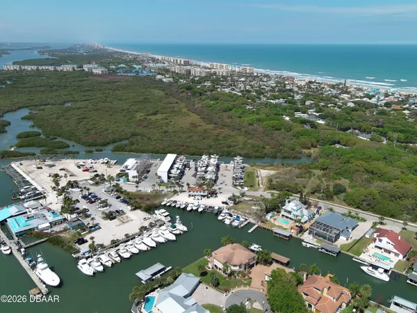 an aerial view of a house with a ocean view