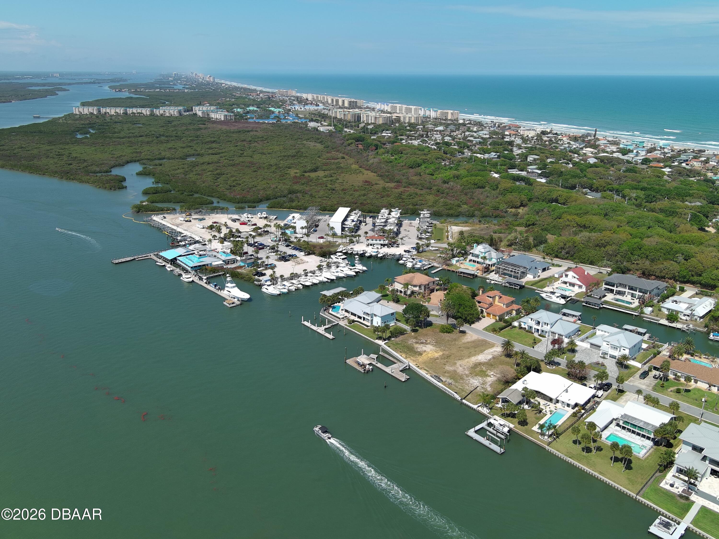 4737 South Peninsula Drive Ponce Inlet, FL 32127 - Photo 14 of 17 a view of a lake with a city