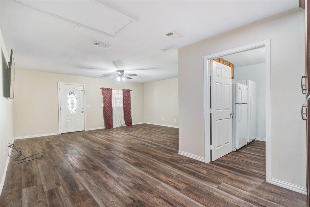 201 Farm To Market 906 Powderly, TX 75473 - Photo 14 of 32 a view of empty room with wooden floor and window