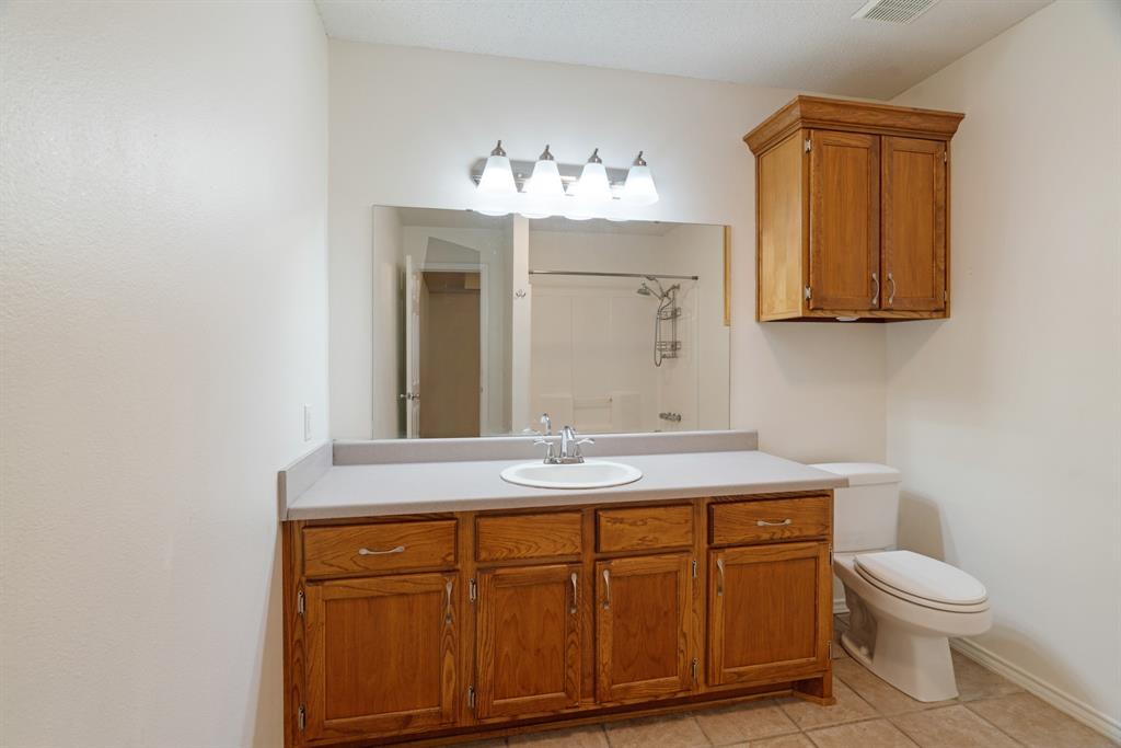 201 Farm To Market 906 Powderly, TX 75473 - Photo 20 of 32 a bathroom with a sink and a mirror