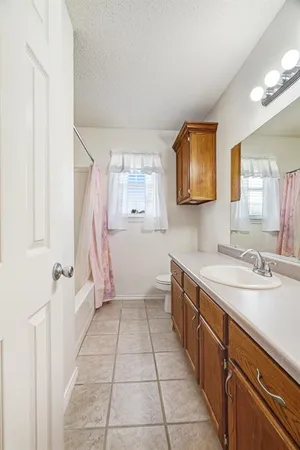a kitchen with a sink and a refrigerator
