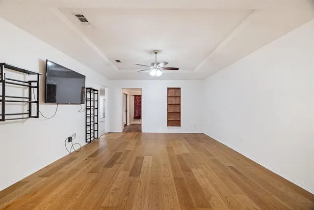 a view of a livingroom with wooden floor