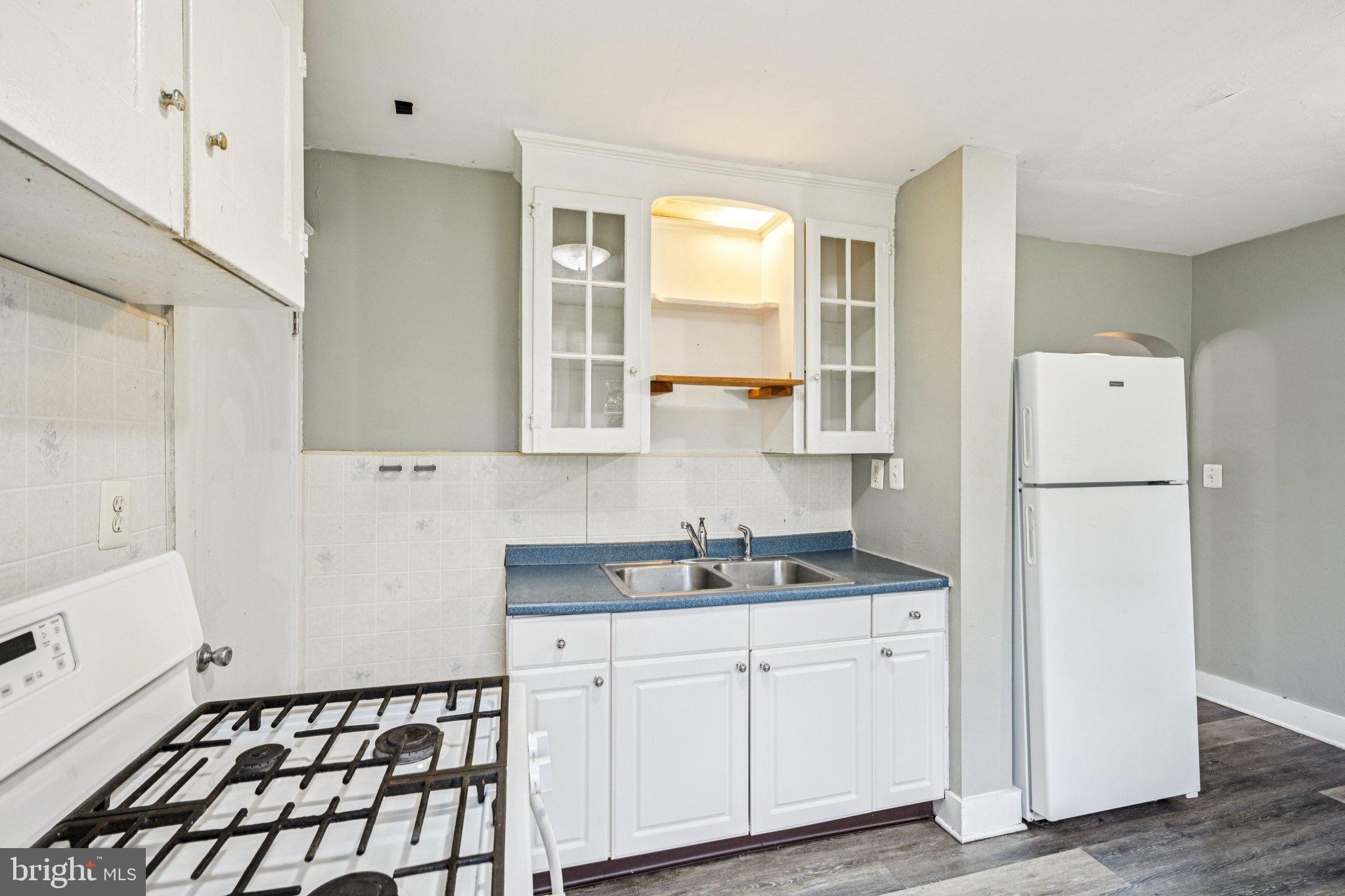 12 Normal Boulevard Glassboro, NJ 08028 - Photo 12 of 28 a kitchen with a refrigerator and a stove top oven