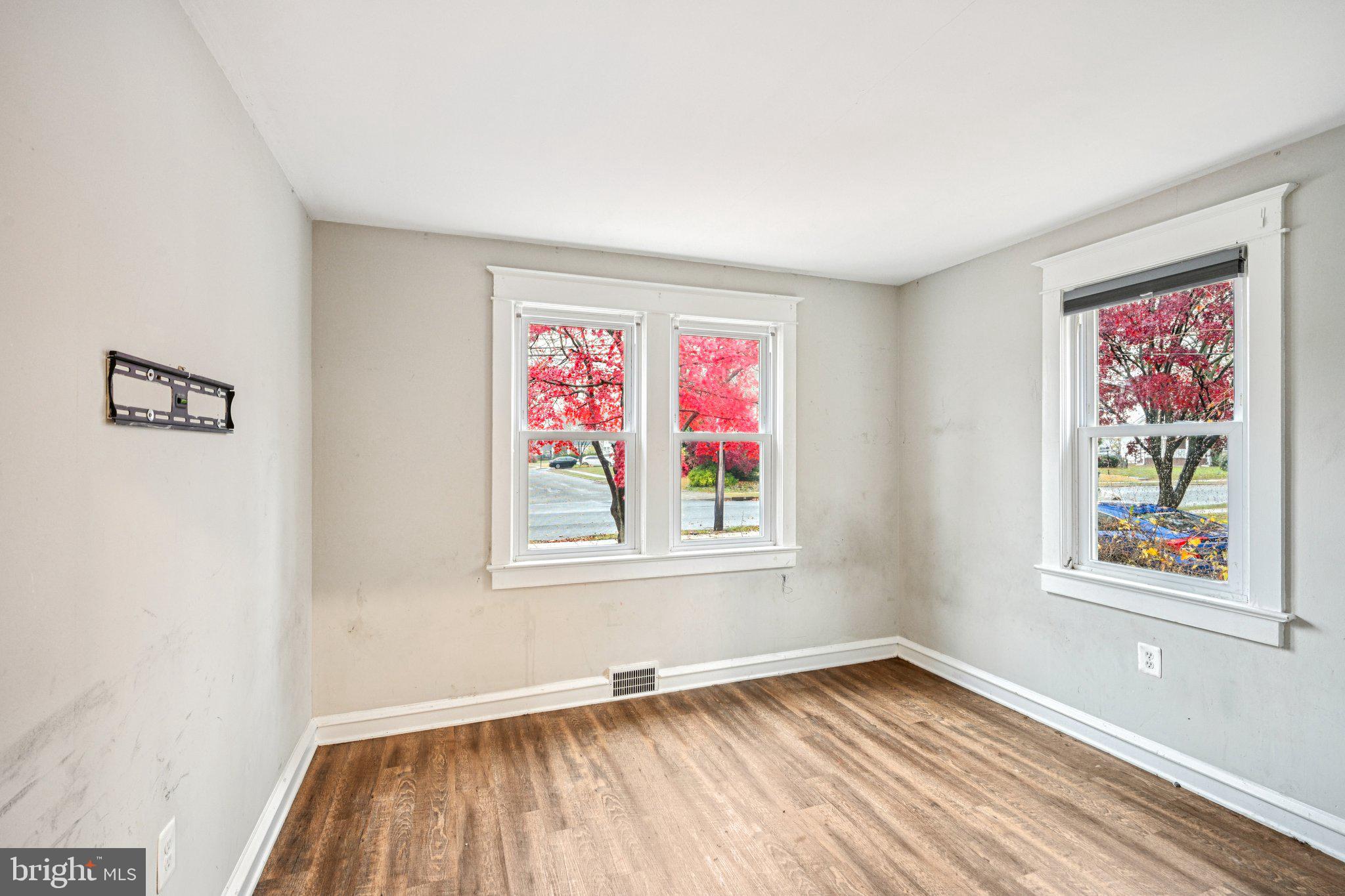 12 Normal Boulevard Glassboro, NJ 08028 - Photo 13 of 28 a view of an empty room with window and wooden floor