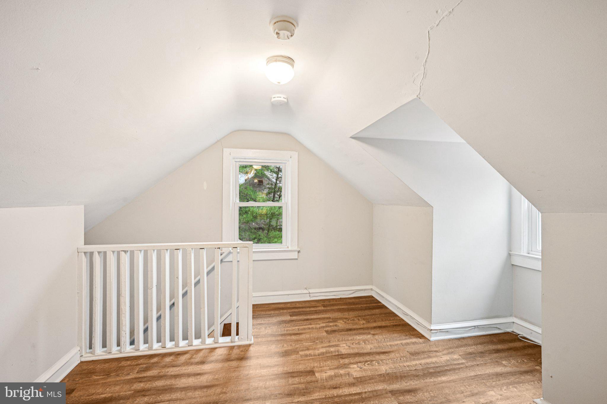 12 Normal Boulevard Glassboro, NJ 08028 - Photo 18 of 28 an empty room with wooden floor and windows