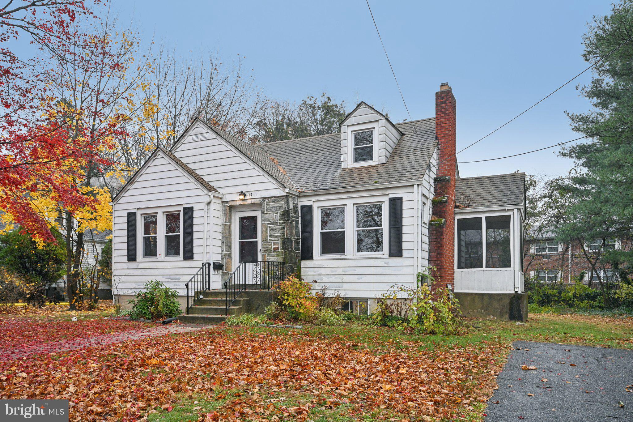 12 Normal Boulevard Glassboro, NJ 08028 - Photo 2 of 28 a front view of a house with garden