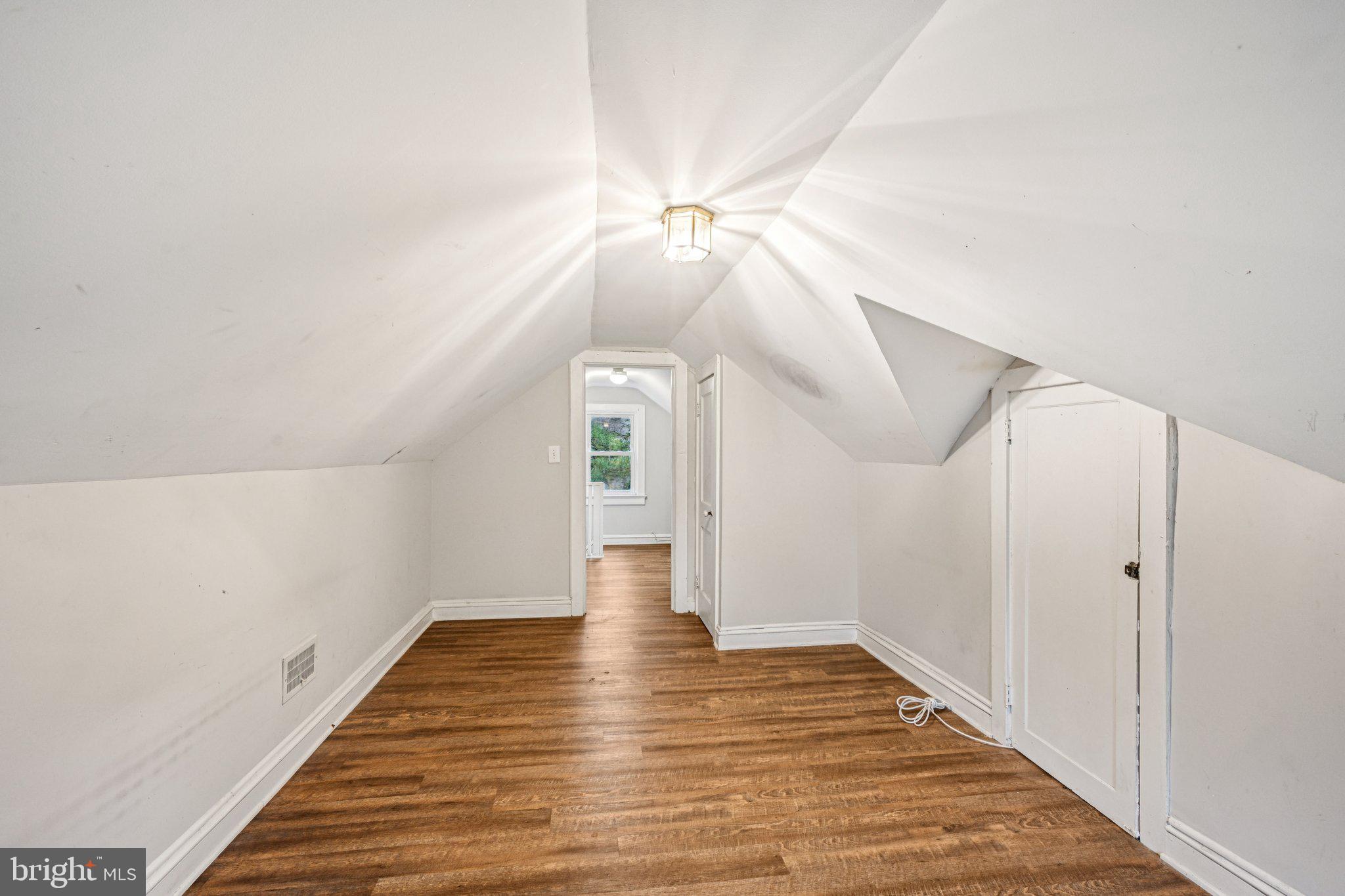 12 Normal Boulevard Glassboro, NJ 08028 - Photo 21 of 28 a view of a hallway with wooden floor and ceiling fan