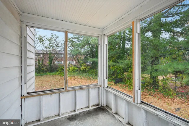a bathroom with a granite countertop sink and glass window