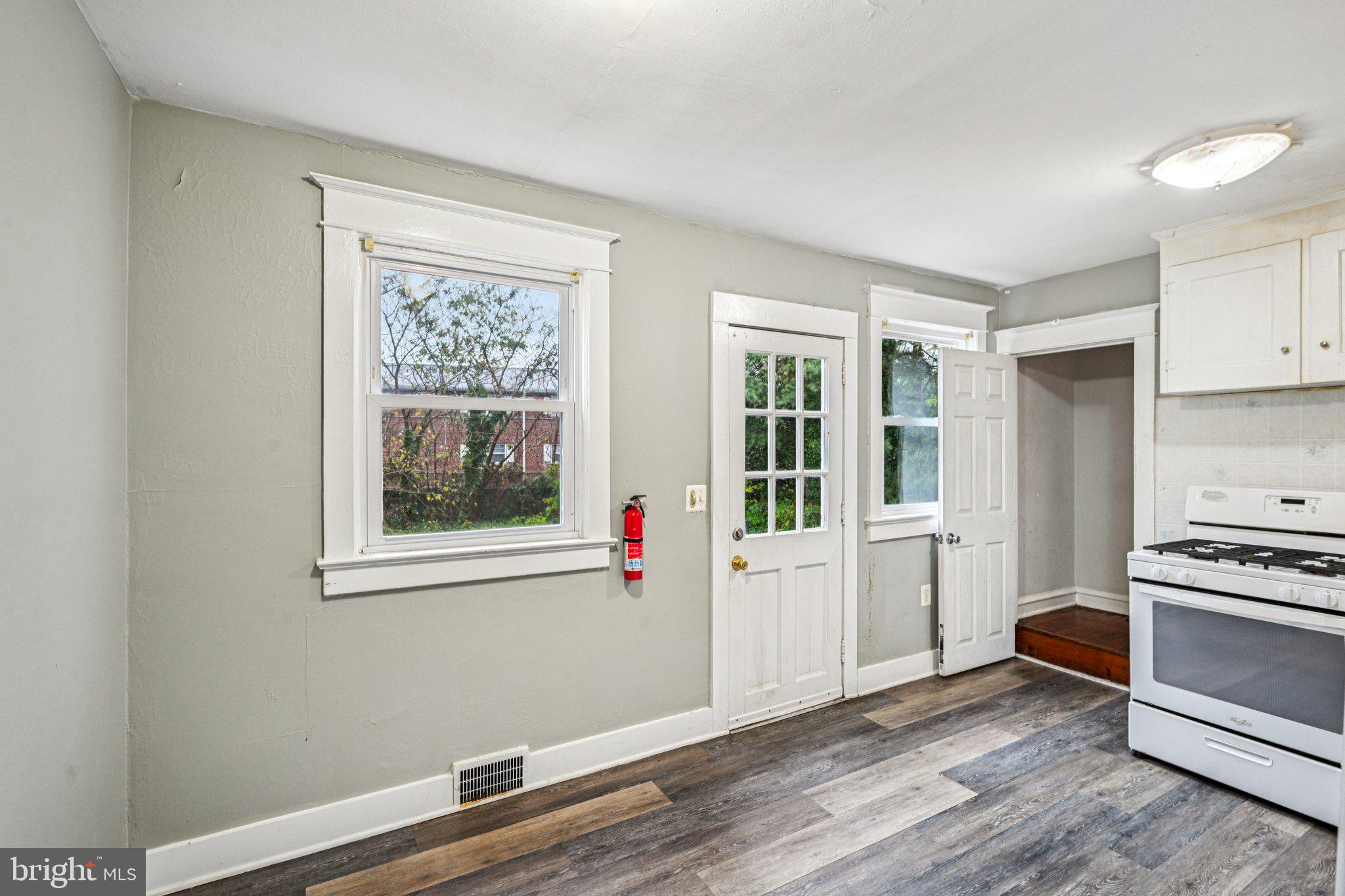 12 Normal Boulevard Glassboro, NJ 08028 - Photo 9 of 28 a view of a kitchen with wooden floor and electronic appliances