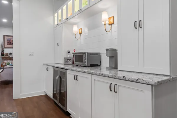 a large white kitchen with lots of counter space