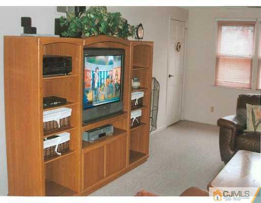 275 Old Post Road Edison, NJ 08817 - Photo 2 of 8 a view of living room with furniture and a window
