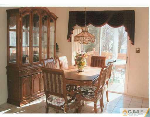 275 Old Post Road Edison, NJ 08817 - Photo 4 of 8 a view of a dining room with furniture and chandelier