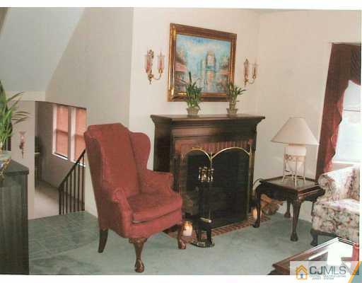 275 Old Post Road Edison, NJ 08817 - Photo 5 of 8 a living room with furniture and a fireplace