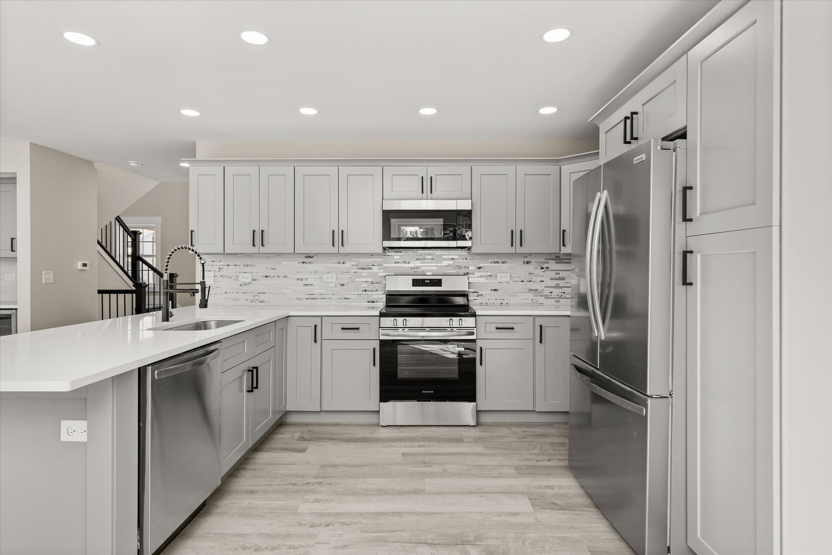 120 Kevin Drive Diamond, IL 60416 - Photo 12 of 24 a kitchen with granite countertop a refrigerator stove and sink