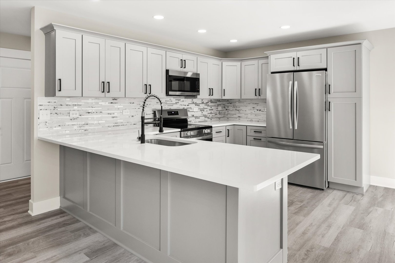120 Kevin Drive Diamond, IL 60416 - Photo 15 of 24 a kitchen with kitchen island a white counter top space cabinets stainless steel appliances and cabinets