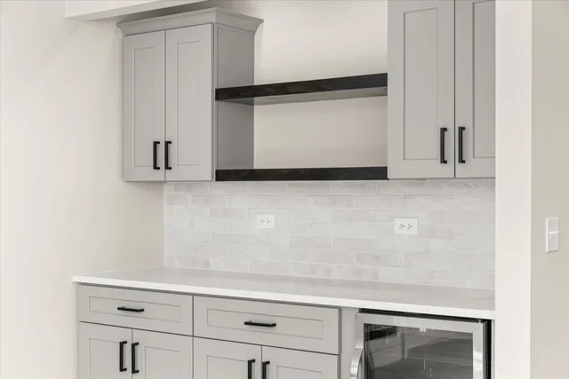 a view of white cabinets and a wooden floor