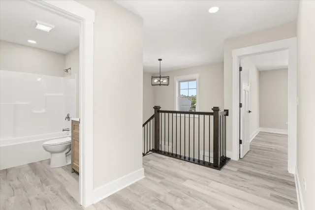 a view of a bathroom from a hallway