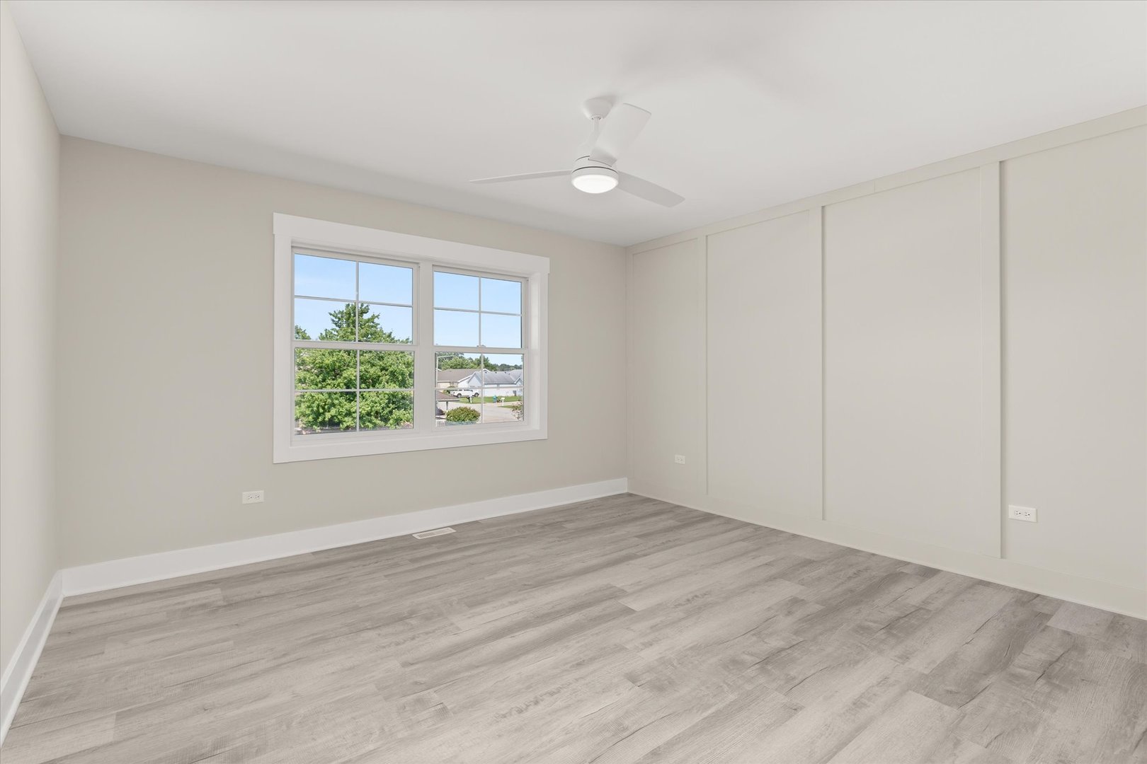 120 Kevin Drive Diamond, IL 60416 - Photo 23 of 24 an empty room with wooden floor and windows