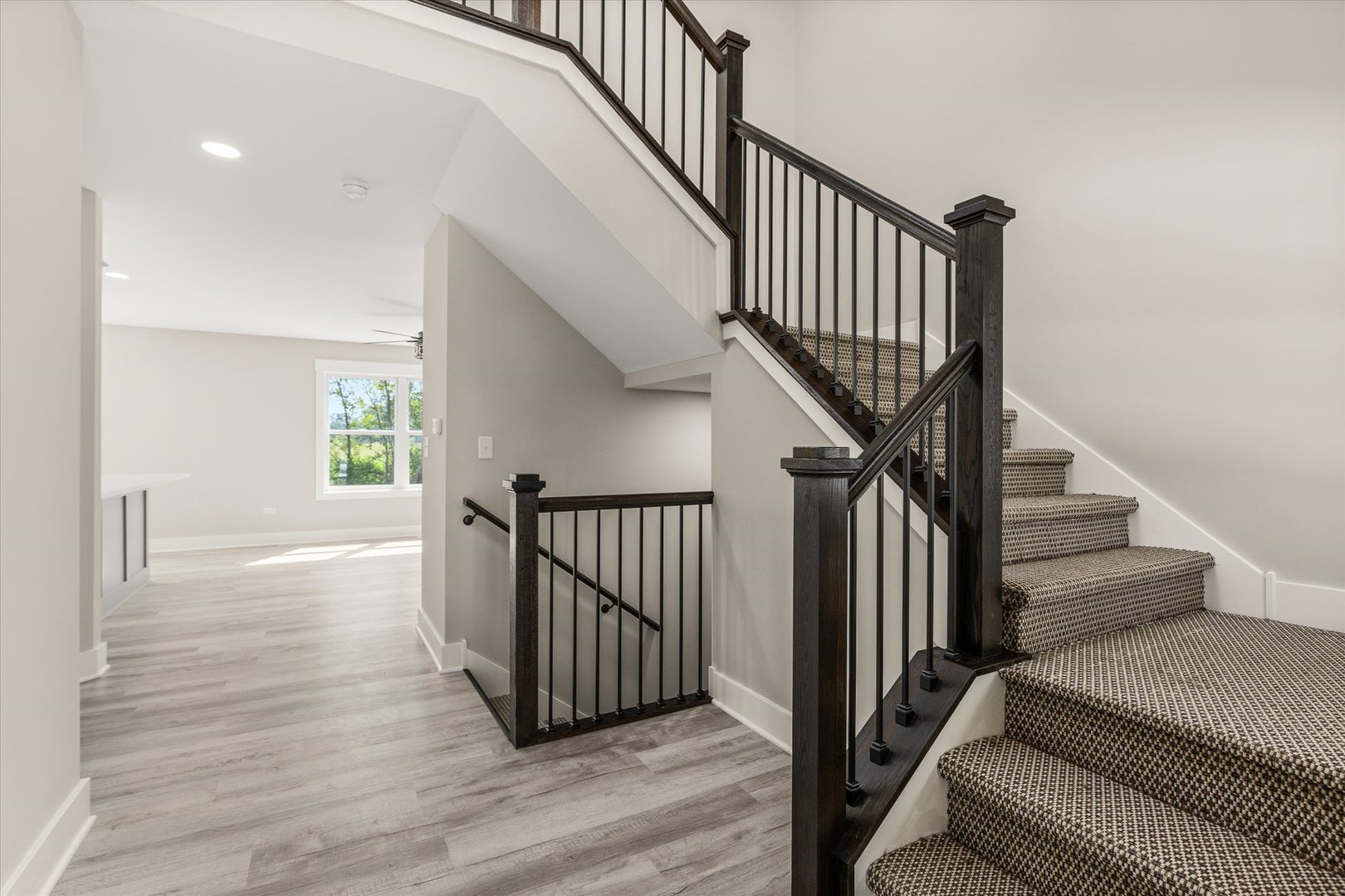 120 Kevin Drive Diamond, IL 60416 - Photo 4 of 24 a view of staircase with wooden floor and a rug