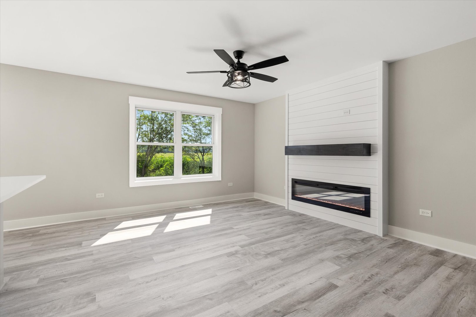 120 Kevin Drive Diamond, IL 60416 - Photo 8 of 24 wooden floor in an empty room with a window