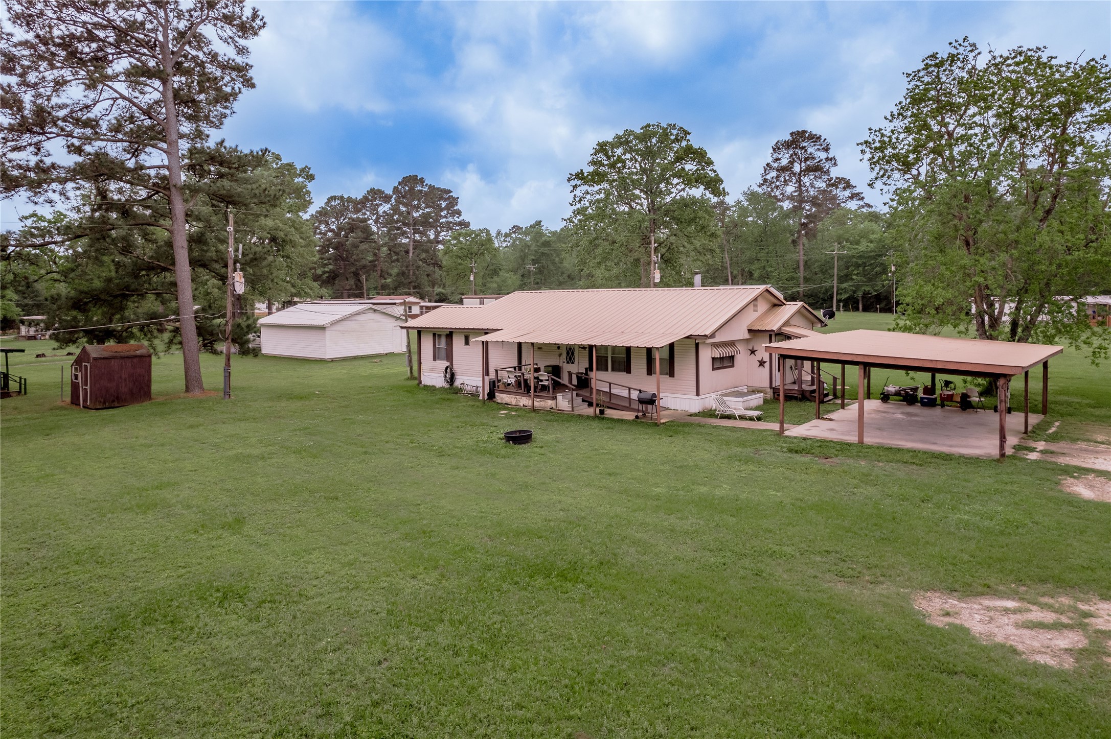 151 Moon Lake Drive Trinity, TX 75862 - Photo 1 of 46 a view of a house with garden and a sitting area