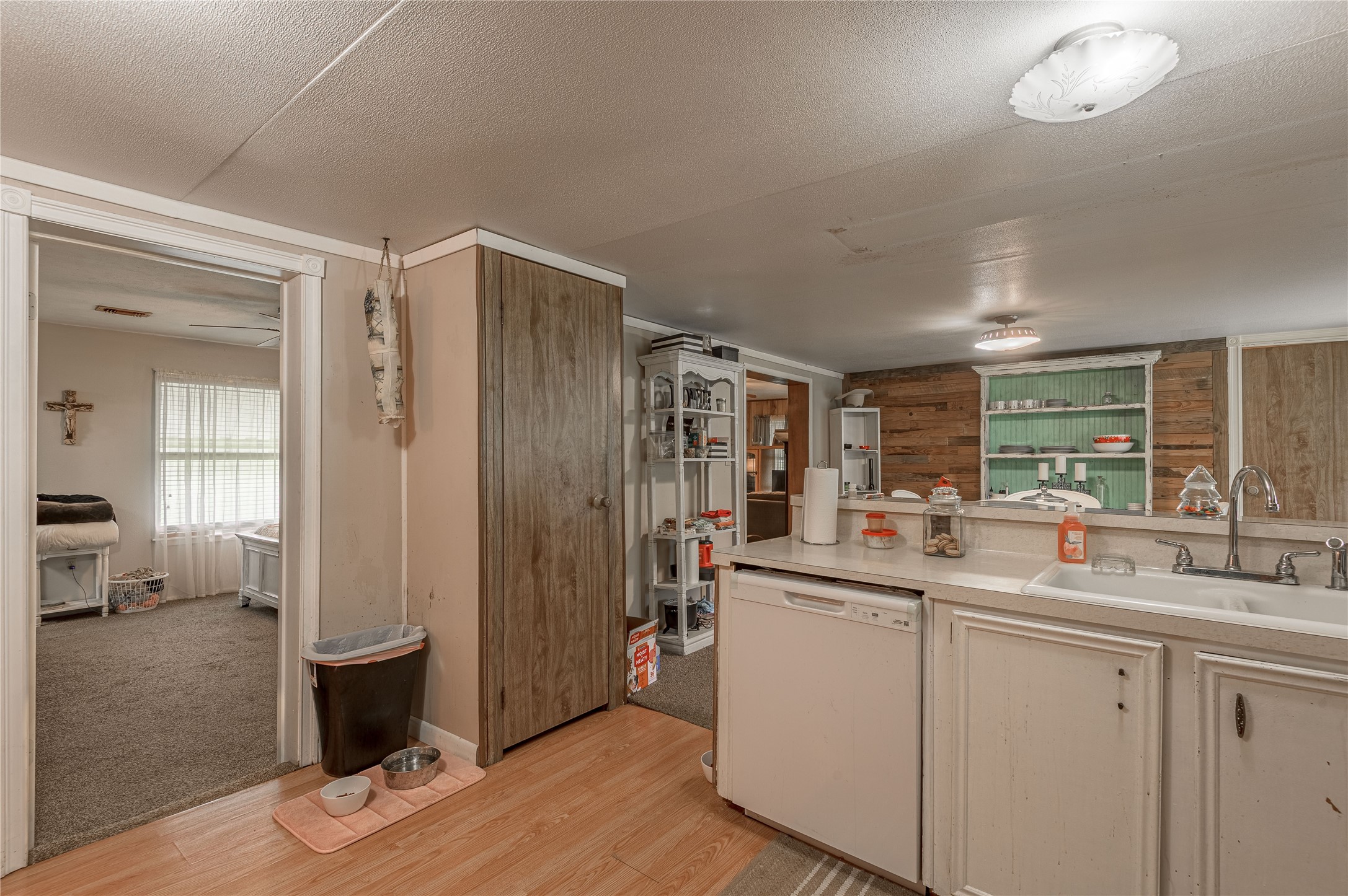 151 Moon Lake Drive Trinity, TX 75862 - Photo 14 of 46 a kitchen with sink and refrigerator
