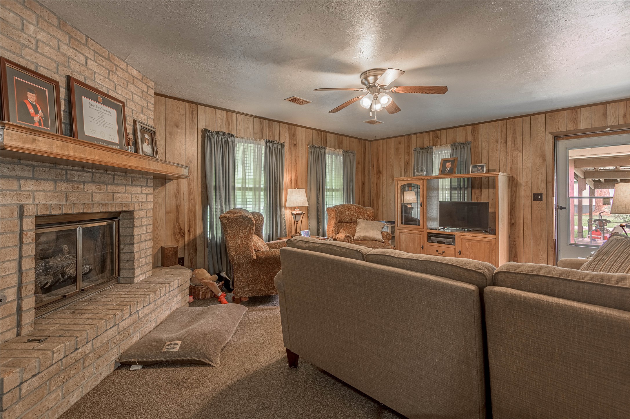 151 Moon Lake Drive Trinity, TX 75862 - Photo 15 of 46 a living room with furniture and a fireplace
