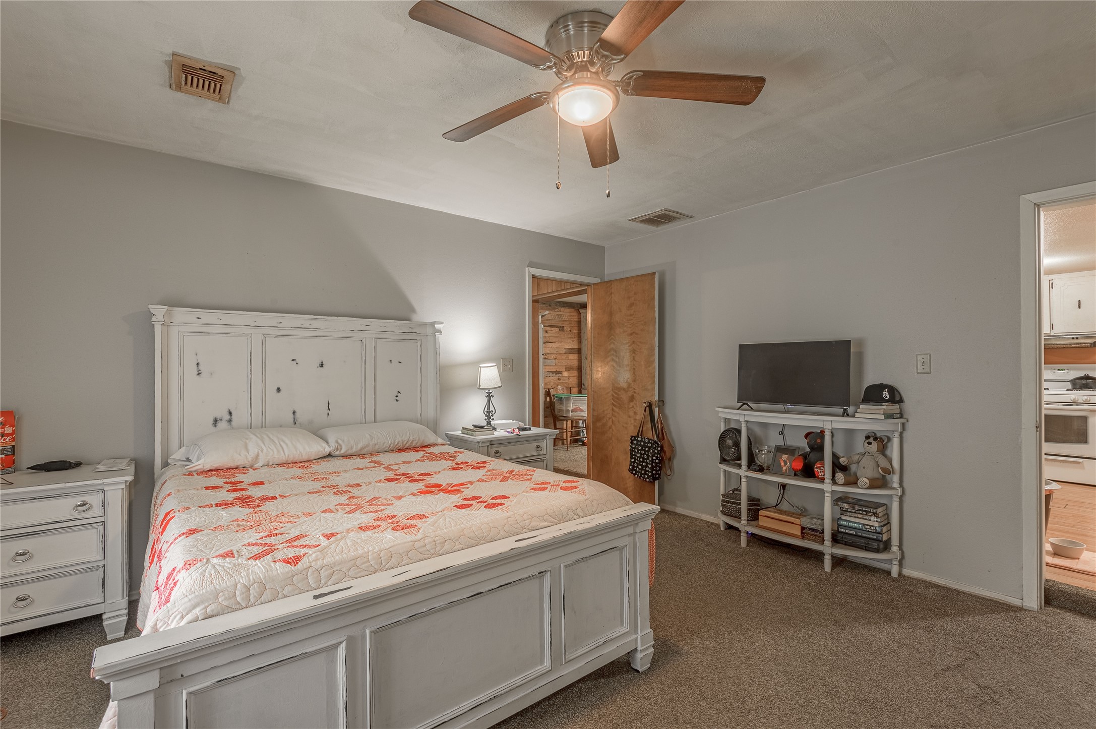 151 Moon Lake Drive Trinity, TX 75862 - Photo 21 of 46 a bedroom with a bed and a flat screen tv