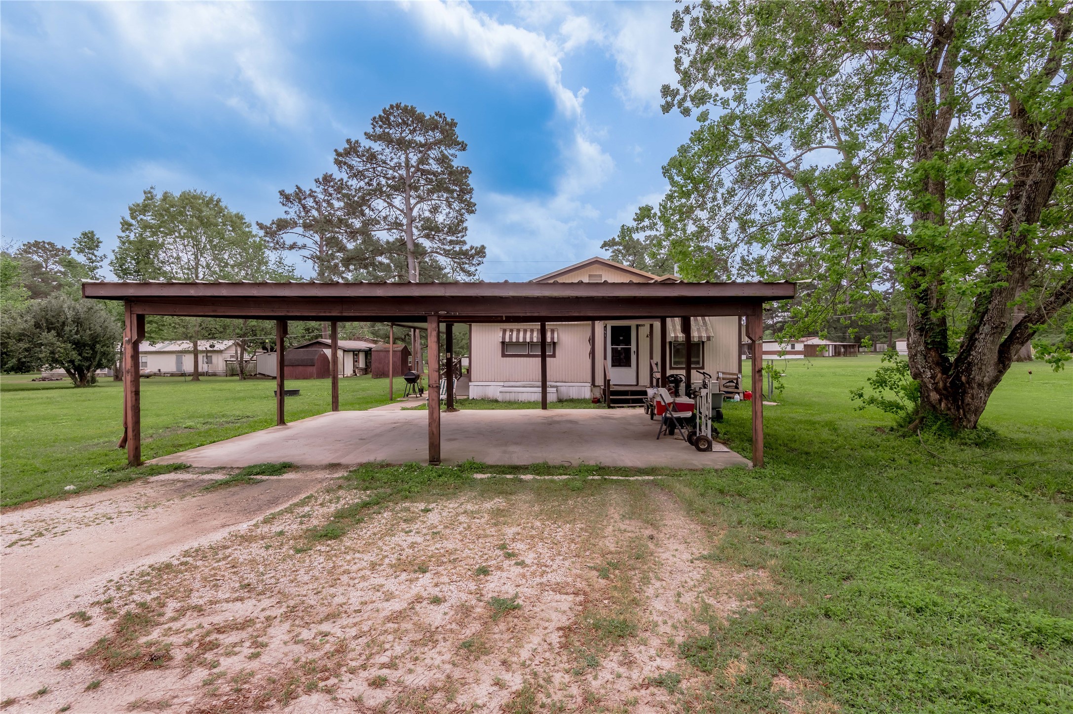 151 Moon Lake Drive Trinity, TX 75862 - Photo 30 of 46 a view of a house with a yard porch and sitting area
