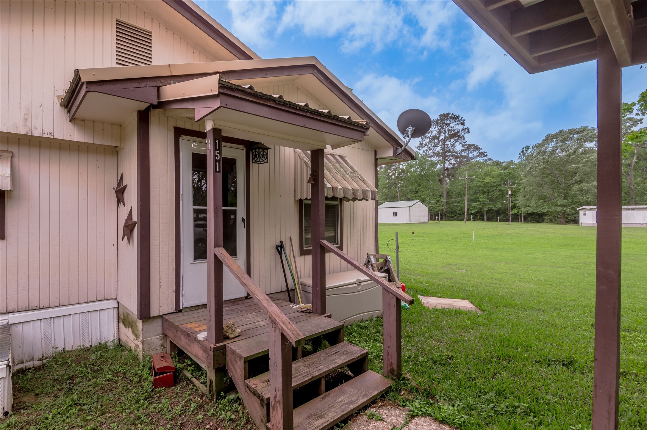 151 Moon Lake Drive Trinity, TX 75862 - Photo 31 of 46 a front view of a house with garden