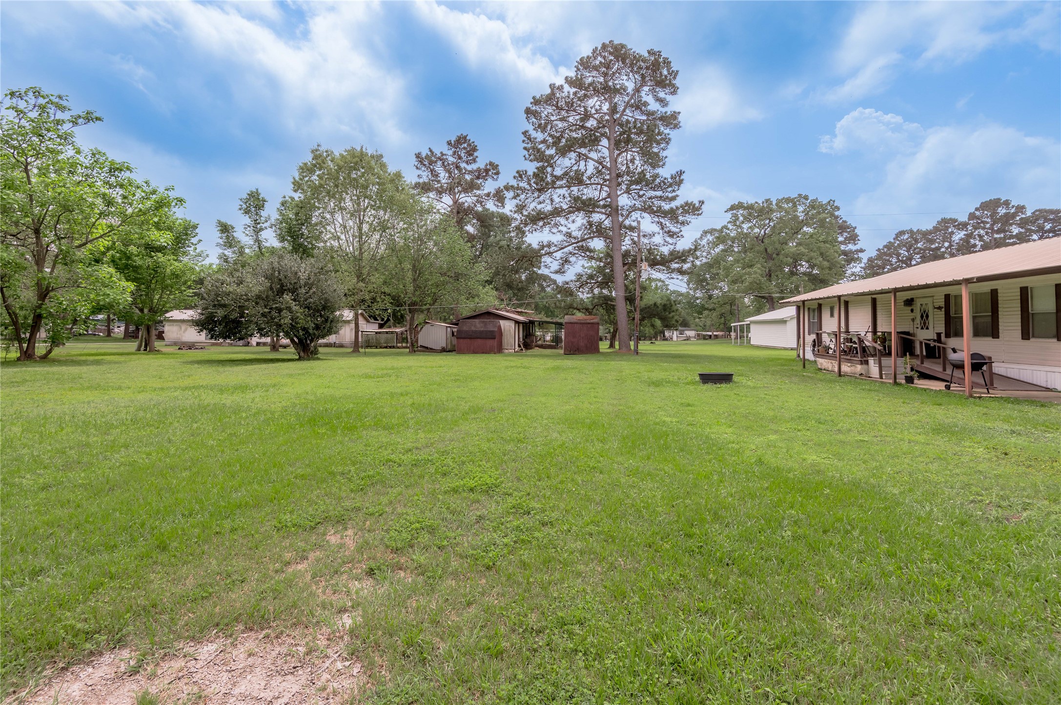 151 Moon Lake Drive Trinity, TX 75862 - Photo 34 of 46 a view of a house with a big yard and large trees