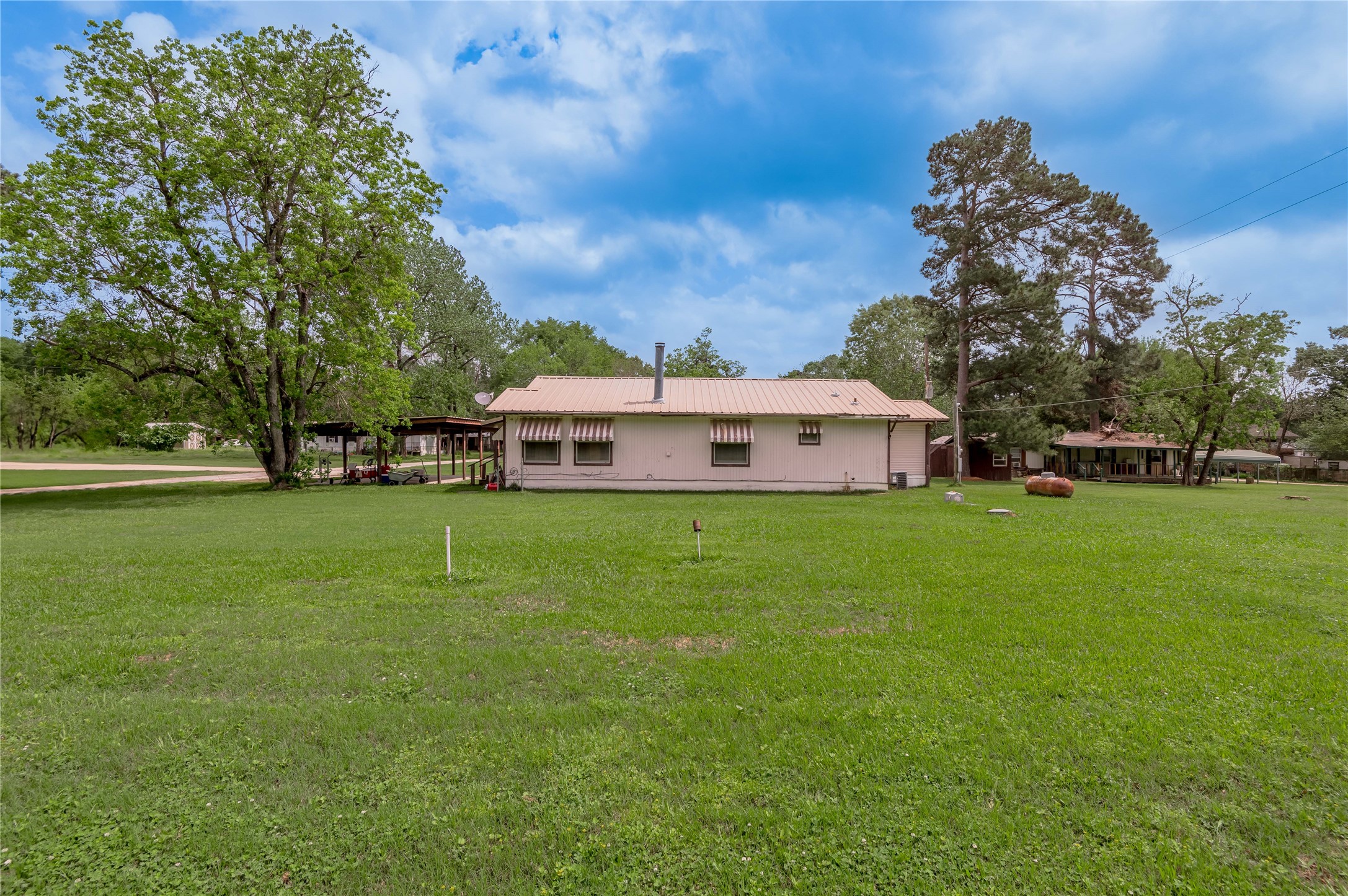 151 Moon Lake Drive Trinity, TX 75862 - Photo 35 of 46 a front view of a house with garden