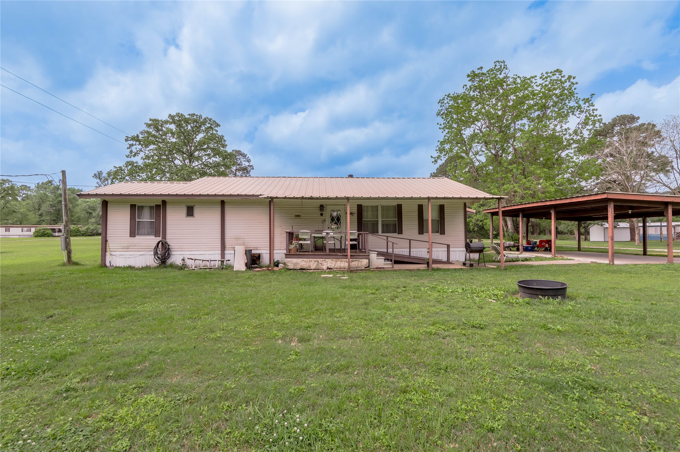 151 Moon Lake Drive Trinity, TX 75862 - Photo 4 of 46 front view of a house with a garden