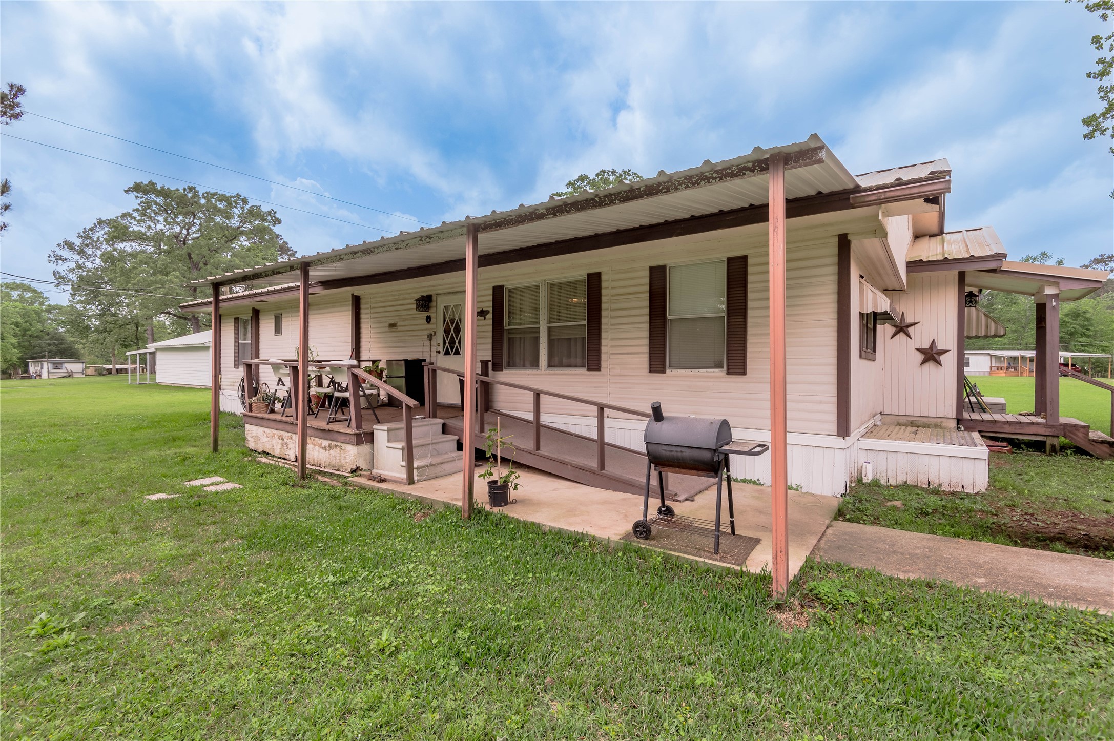 151 Moon Lake Drive Trinity, TX 75862 - Photo 5 of 46 a view of a house with a yard and sitting area