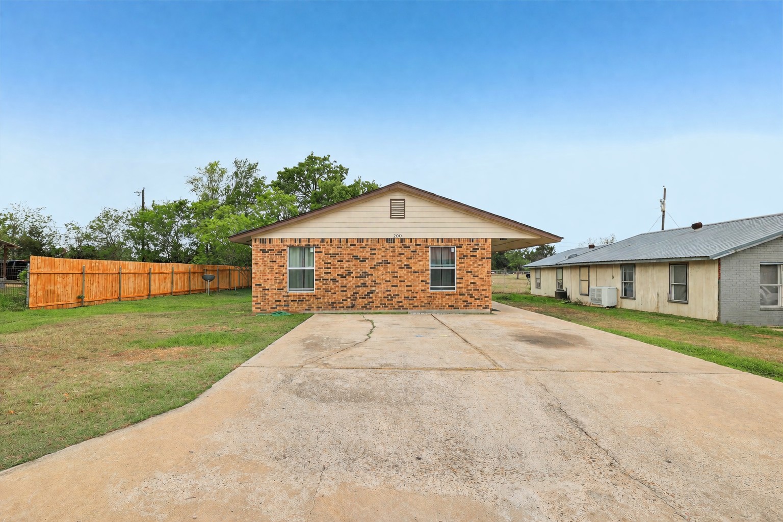 200 Monterrey Street, Unit A & B Elgin, TX 78621 - Photo 32 of 32 Extra large driveway in front of duplex. 200 Monterrey, Elgin, TX 78621