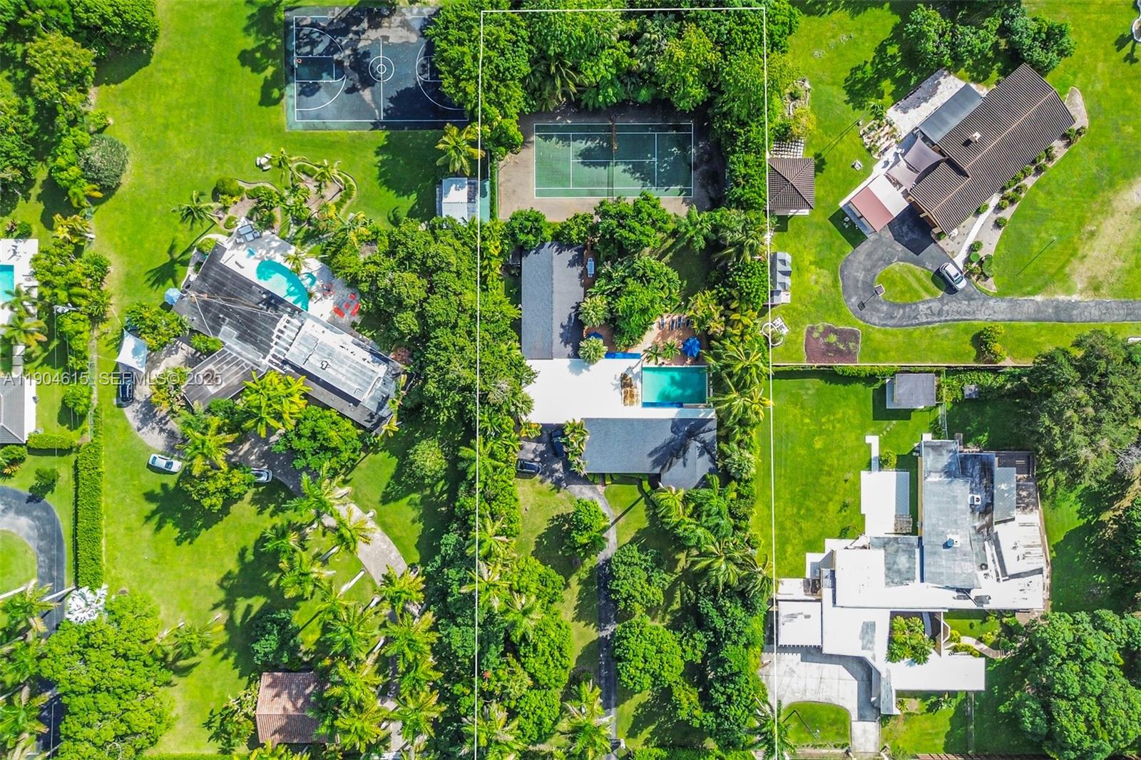 7701 Southwest 79th Court Miami, FL 33143 - Photo 1 of 10 an aerial view of multiple houses with yard
