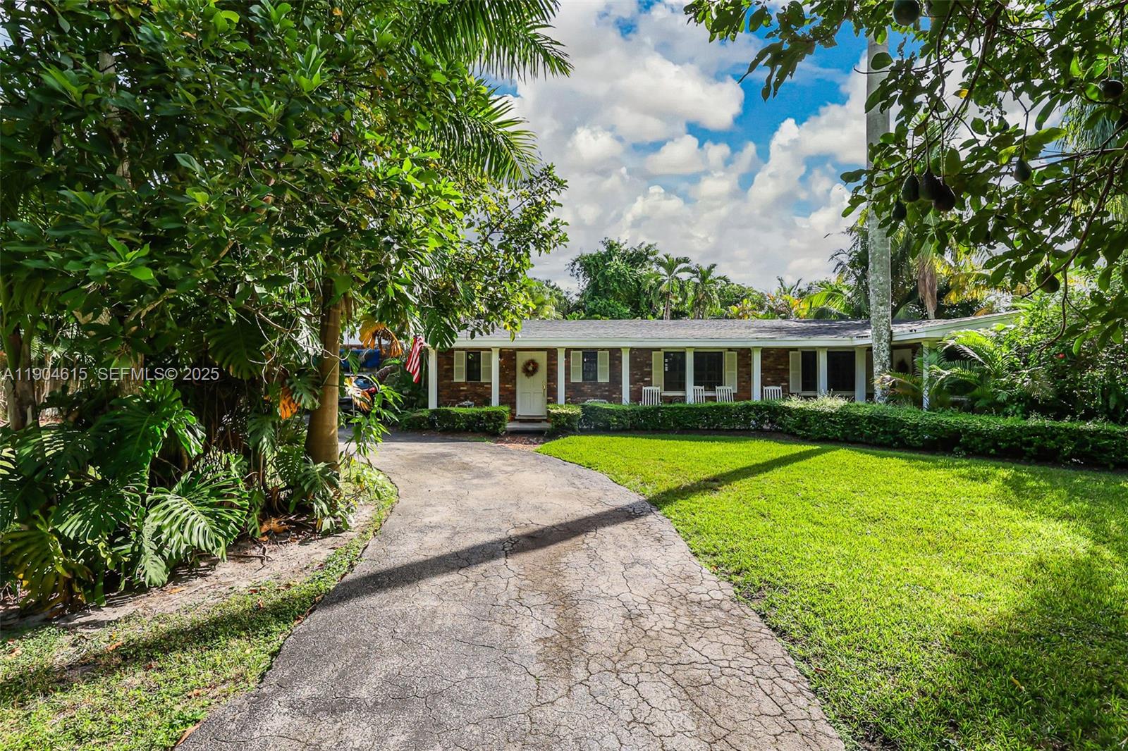 7701 Southwest 79th Court Miami, FL 33143 - Photo 4 of 10 a view of house with a yard