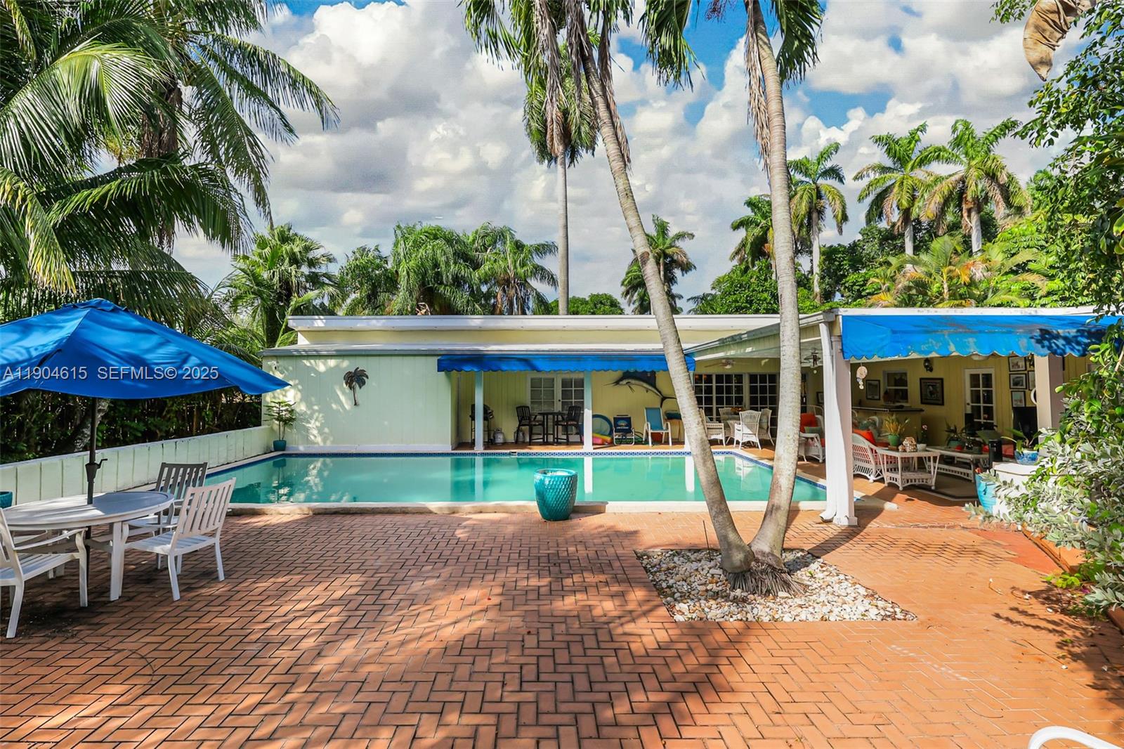 7701 Southwest 79th Court Miami, FL 33143 - Photo 5 of 10 a view of a house with backyard and sitting area