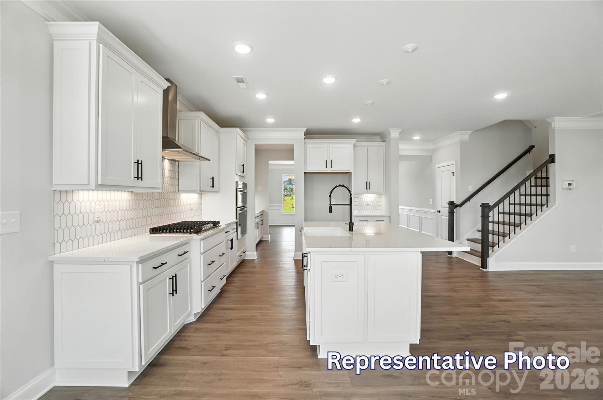 10818 Coble Road Mint Hill, NC 28227 - Photo 13 of 38 a large kitchen with stainless steel appliances kitchen island granite countertop a large counter top and a stove