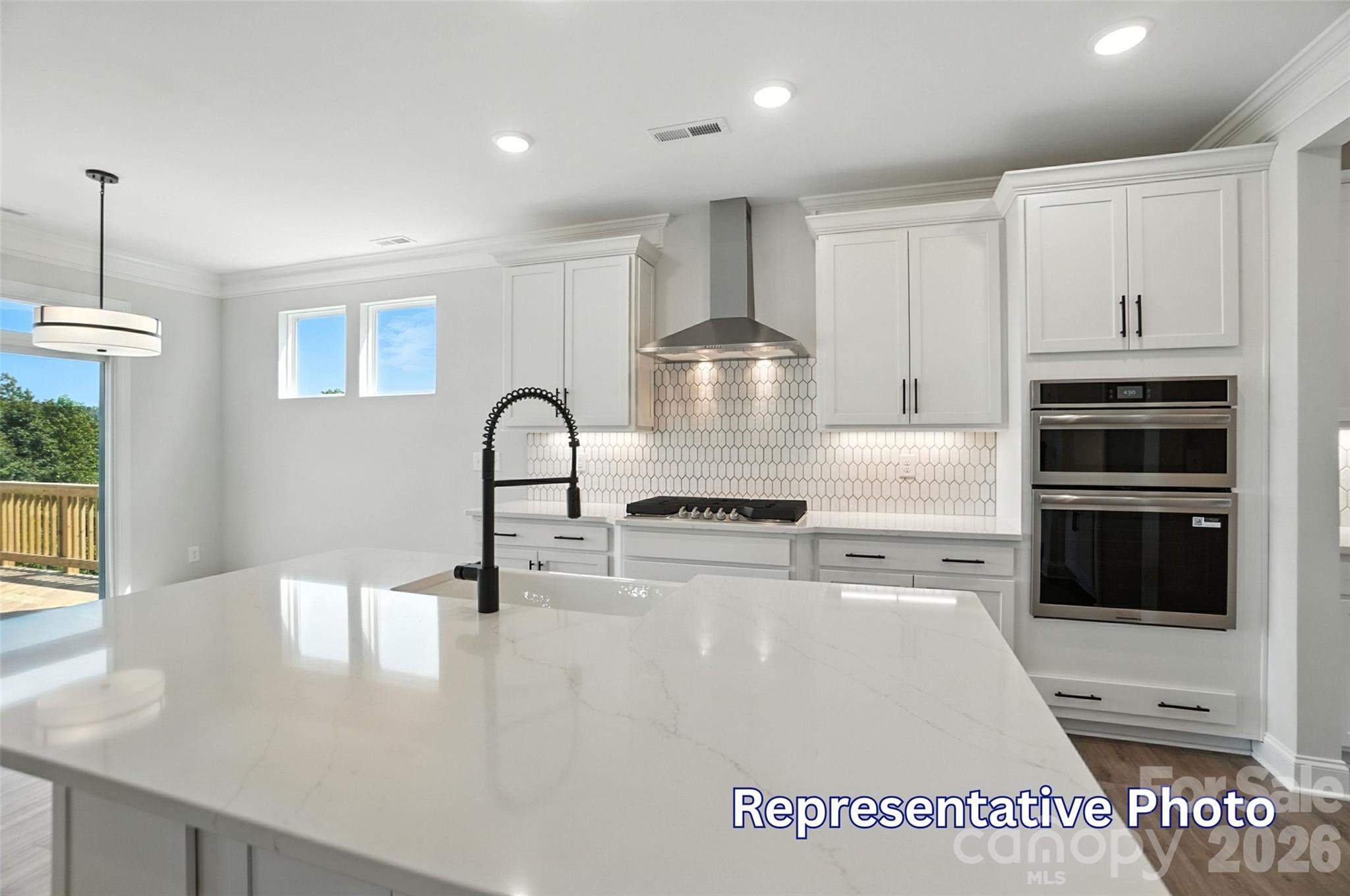 10818 Coble Road Mint Hill, NC 28227 - Photo 15 of 38 a kitchen with stainless steel appliances granite countertop a sink a stove and a refrigerator
