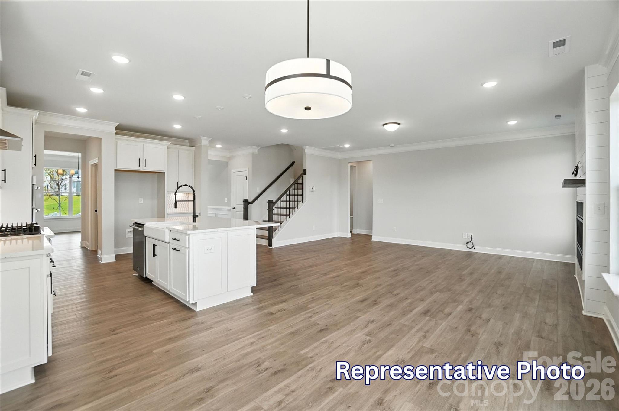 10818 Coble Road Mint Hill, NC 28227 - Photo 16 of 38 a view of a kitchen with furniture and a wooden floor