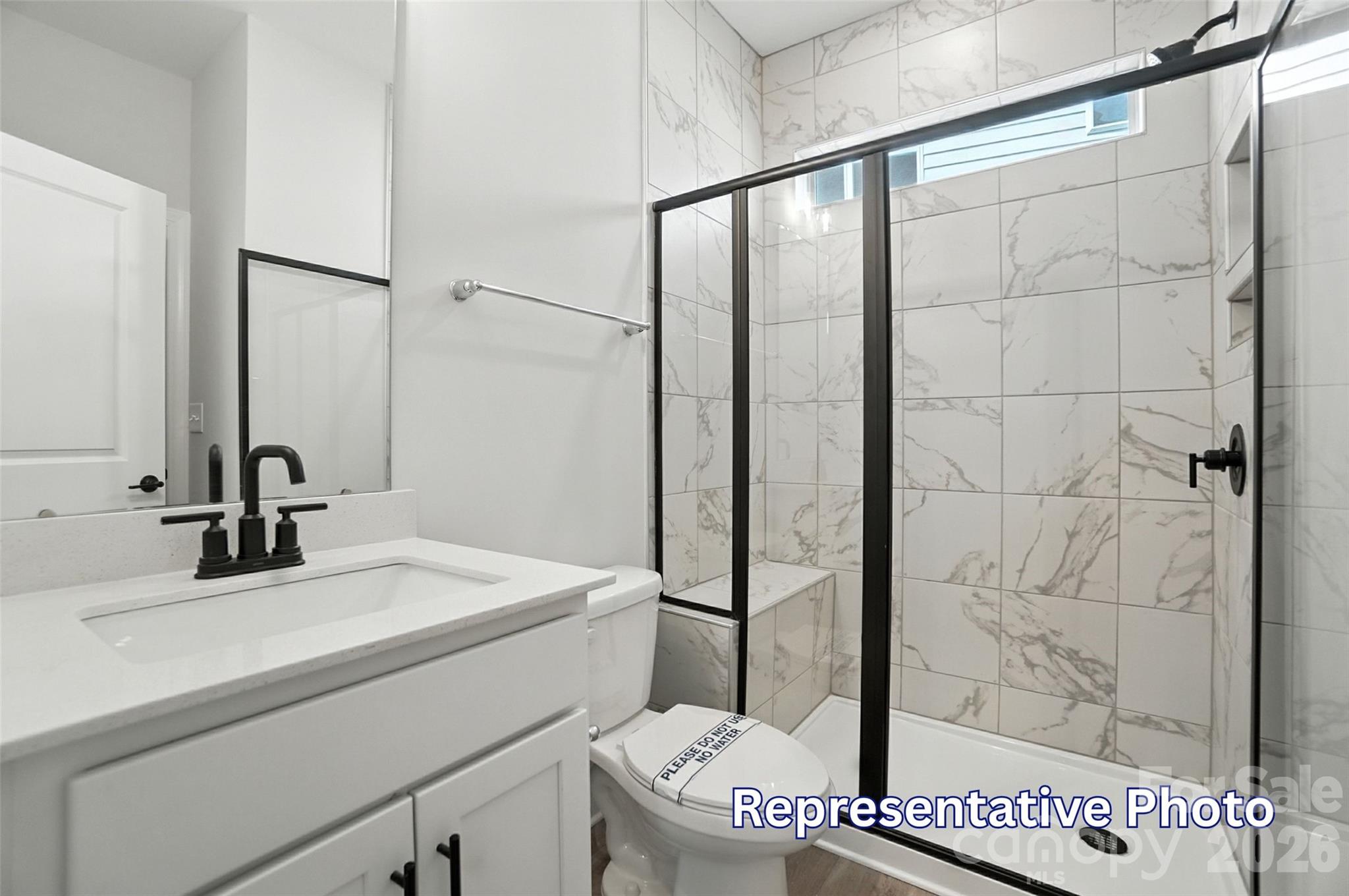 10818 Coble Road Mint Hill, NC 28227 - Photo 18 of 38 a bathroom with a sink and a mirror