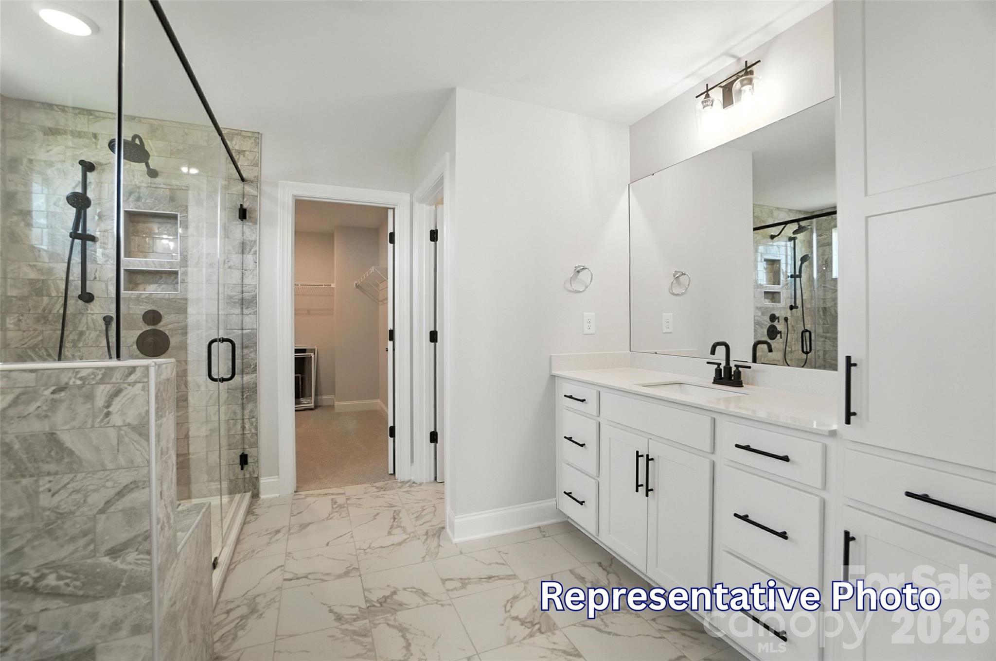 10818 Coble Road Mint Hill, NC 28227 - Photo 28 of 38 a spacious bathroom with a shower and a sink