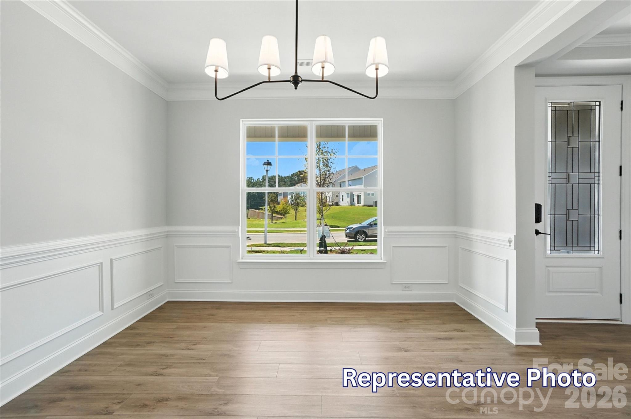 10818 Coble Road Mint Hill, NC 28227 - Photo 9 of 38 an empty room with wooden floor and windows