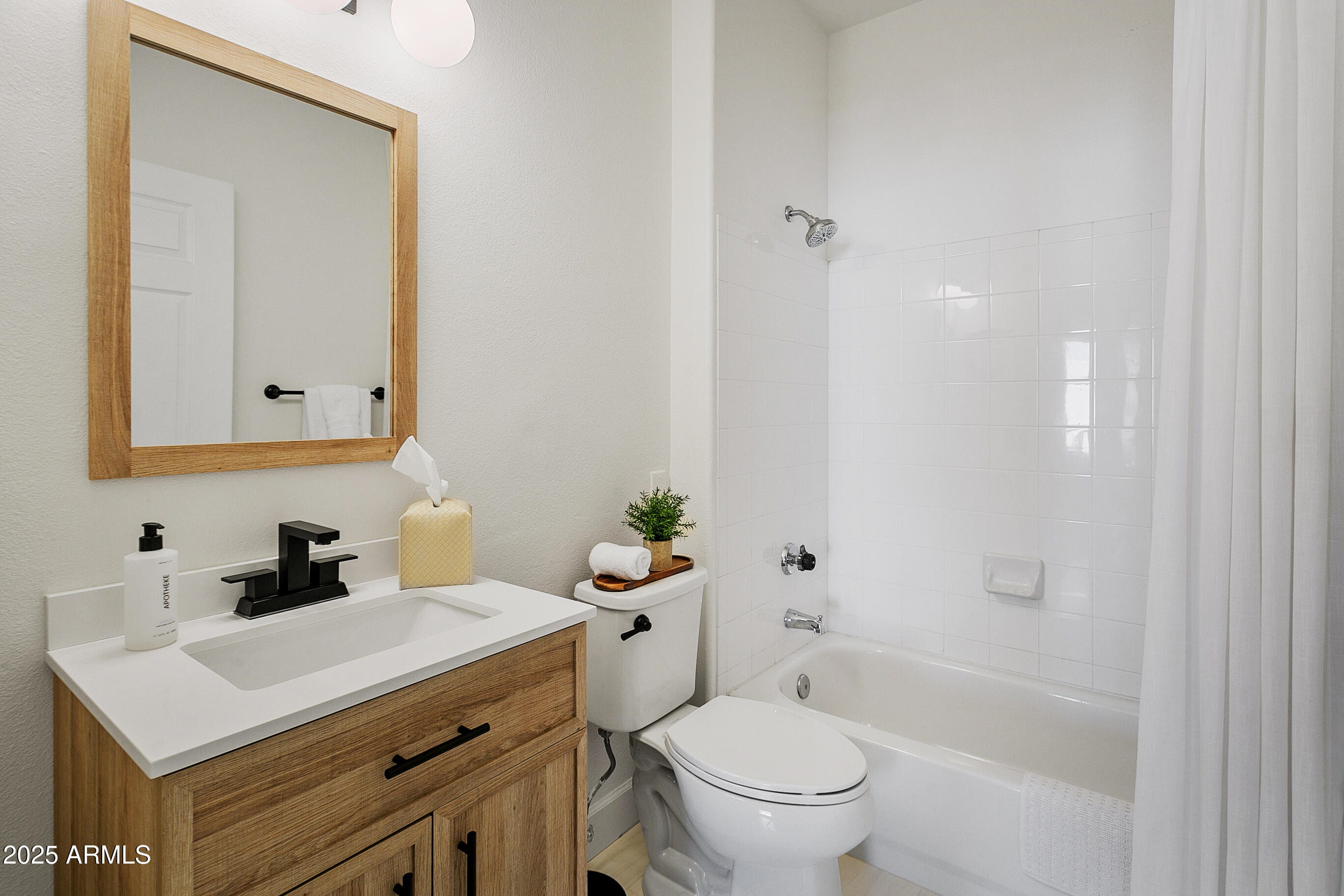 9550 East Thunderbird Road, Unit 228 Scottsdale, AZ 85260 - Photo 13 of 29 a bathroom with a sink toilet and shower