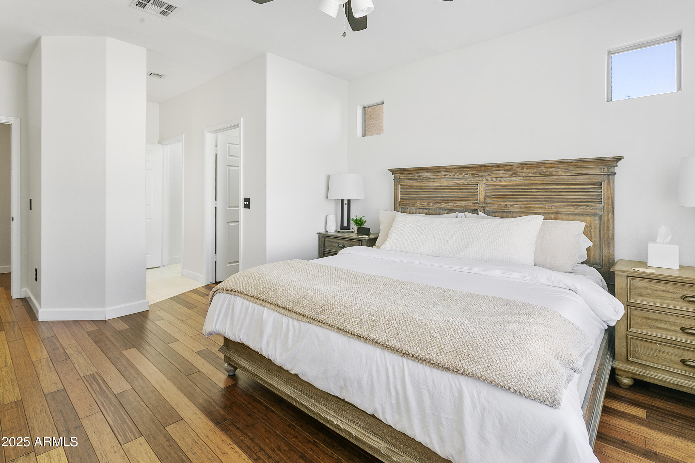 9550 East Thunderbird Road, Unit 228 Scottsdale, AZ 85260 - Photo 15 of 29 a bedroom with a bed and wooden floor