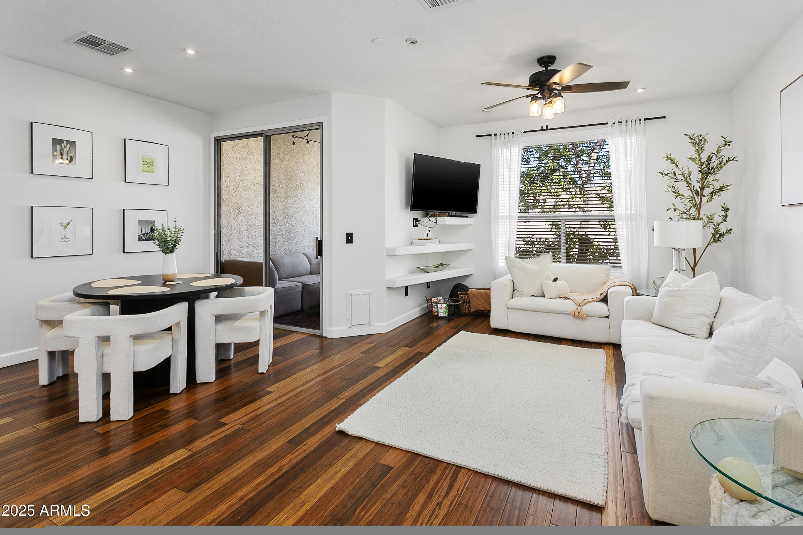 9550 East Thunderbird Road, Unit 228 Scottsdale, AZ 85260 - Photo 2 of 29 a living room with furniture and a flat screen tv