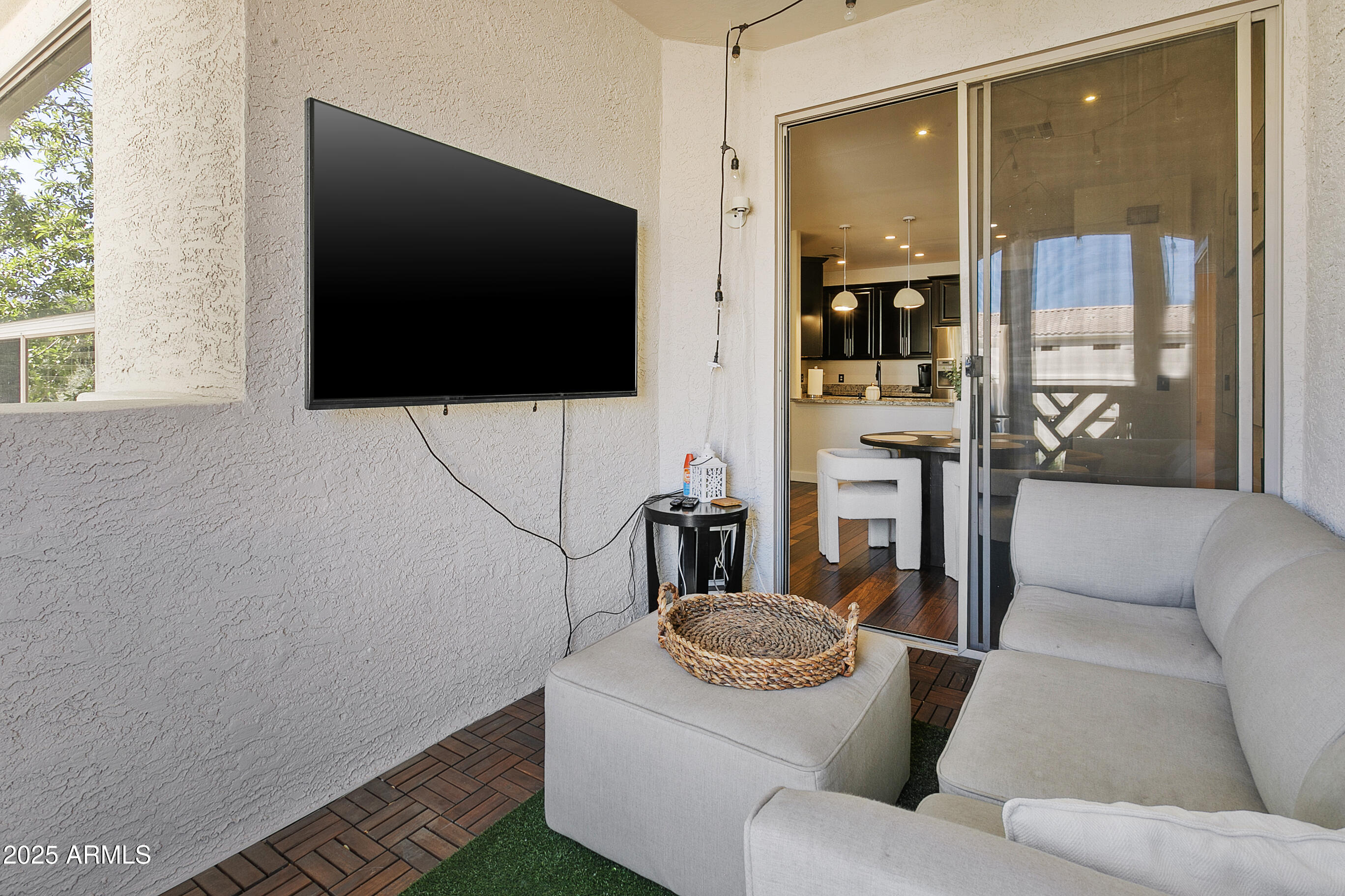 9550 East Thunderbird Road, Unit 228 Scottsdale, AZ 85260 - Photo 22 of 29 a living room with furniture and a flat screen tv